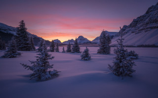 Sunset snowy mountain forest city - a sunset over a snowy mountain free wallpaper