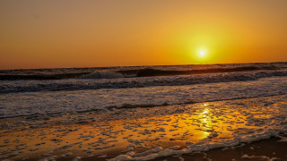Sunset ocean waves beach person 5 - the beach in the distance free wallpaper