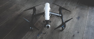 Remote controlled black white drone - les automatiste free wallpaper