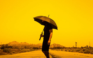Desert man umbrella gun autumn - his hand and a gun free wallpaper