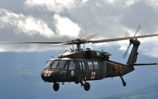 Helicopter cloudy sky mountains military - a helicopter free wallpaper