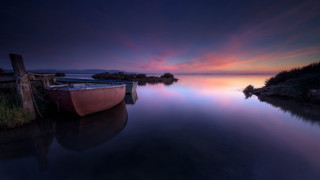 Lake sunset boat mountain sky 2 - a colorful sky in the background free wallpaper