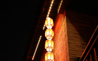 Building lit lamp night dark - a dark sky in the background free wallpaper