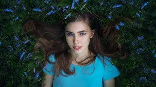 Woman grass blowing hair blue - blue flower free wallpaper