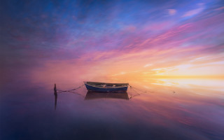 Boat water sunset mountain sky - a colorful sky in the background free wallpaper