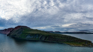 Lake island cloudy sky mountain - a small island in the middle of it free wallpaper