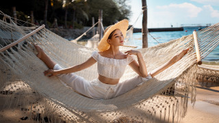 Beach hammock woman strawhat smoking - a hammock free wallpaper