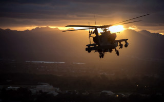 Helicopter sunset mountains backlit puzzle - the background in the distance free wallpaper
