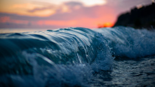 Wave sunset beach pink sky - a pink sky in the background free wallpaper for desktop