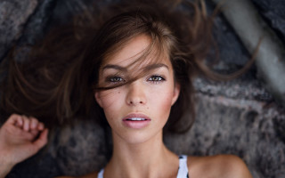 Woman laying rock blurry background - annabel eyres free wallpaper