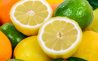 Lemons limes leaves cut half - one cut free wallpaper