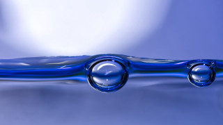 Blue water droplet abstract macro - a white cloud free wallpaper