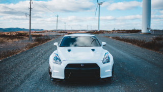 White sports car gravel road 2 - a white sports car free wallpaper for desktop