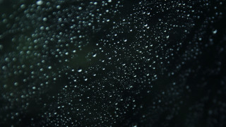 Rain drops window macro night - a close up of a window free wallpaper