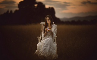 Woman sitting coffee field sunset - a chair holding free wallpaper