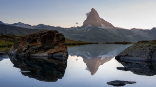 Mountain lake reflection rock cloudy - a rock in the foreground free wallpaper