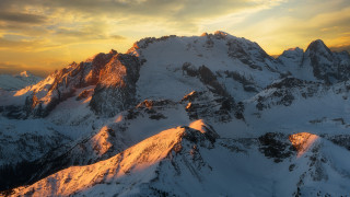 Snowy mountain range plane sunset - sunrise free wallpaper