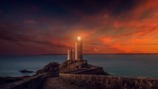 Lighthouse rocky cliff sunset red - a red sky above free wallpaper