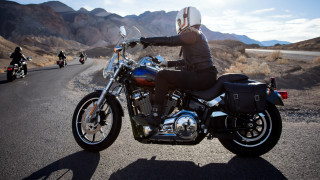 Man riding motorcycle mountains sky - eve ryder free wallpaper