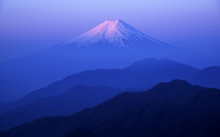 Mountain snowcapped dusk blue sky - peak in the distance free wallpaper