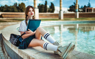 Girl bridge books blue sky - a book in her hand and a book in her other hand free wallpaper