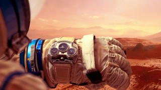 Gloved hand watch desert mountains - solarpunk free wallpaper
