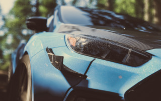 Blue sports car parked wooded - hyper detail free wallpaper