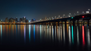 Bridge cityscape nightlights reflections holography - a bridge over a body of water free wallpaper