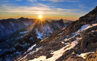 Mountain sunset snow bridge cityscape - a few rock below free wallpaper