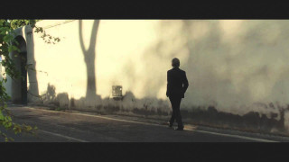 Man in suit walking building - a street next free wallpaper