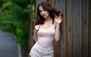 Woman fence blowing hair model - against free wallpaper for desktop