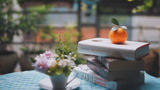 Stack books orange vase flowers - a vase of flowers free wallpaper