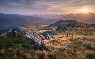 Grassy fence mountains sunset horizon - the horizon free wallpaper