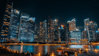 City skyline night water dock 2 - a dock in the foreground free wallpaper