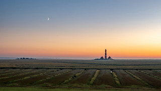 Lighthouse sunset moon beach ridge - a lighthouse in the distance free wallpaper