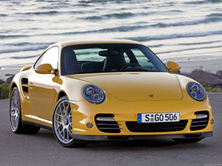 Yellow porsche ocean waves parked - the side of the road near the ocean free wallpaper