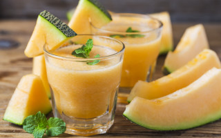 Wooden table fruit veggies glasses - a wooden table free wallpaper