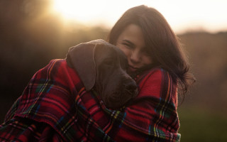 Cozy woman hugging dog sunset - cozy free wallpaper for desktop