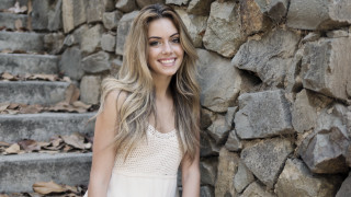 Woman smiling white dress stone - a stone wall free wallpaper for desktop