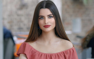 Ayshia Taskin RedTop BrickWall Outdoor - a brick wall behind her free wallpaper