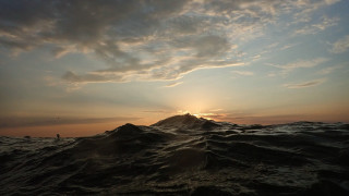 Sunset water island surfboard cityscape - a small island in the distance free wallpaper