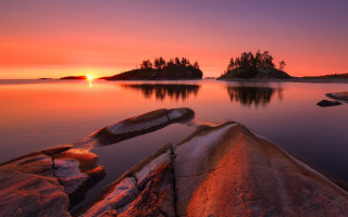 Sunset lake boat island trees - a small island in the distance free wallpaper for desktop