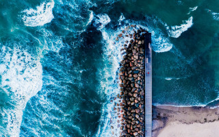 Pier rocks ocean beach tiltshift - the ocean and a beach free wallpaper