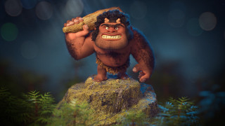 Cartoon character holding branch rock - a blurry background of trees free wallpaper for desktop