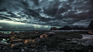 Cloudy beach lighthouse ocean mountains - rocky free wallpaper for desktop