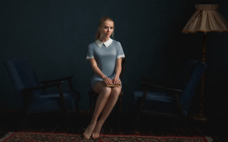 Woman chair room lamp rug - studio portrait free wallpaper