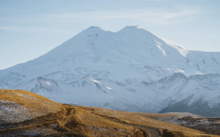 Snowy mountain road trees tiltshift - the side of it free wallpaper