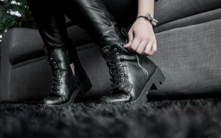 Woman tying boots living room - grunge aesthetic free wallpaper