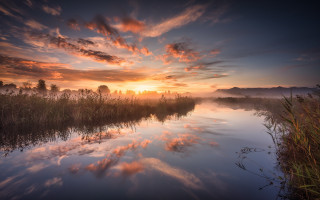 River sunset clouds trees cityscape - artur tarnowski free wallpaper