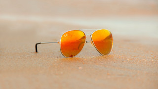 Sunglasses beach ocean sand sky - a pair of sunglasses free wallpaper